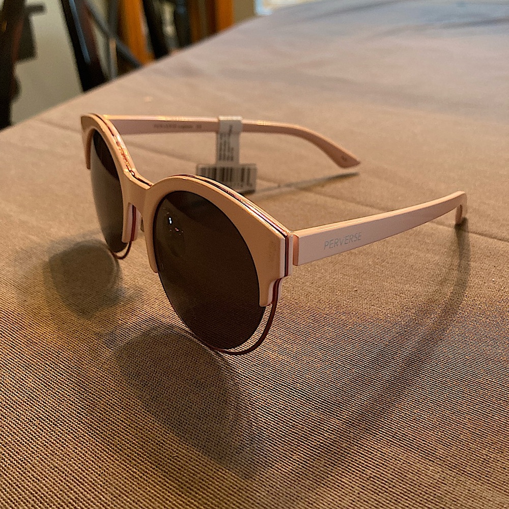 Pink perverse cat eye glasses.
